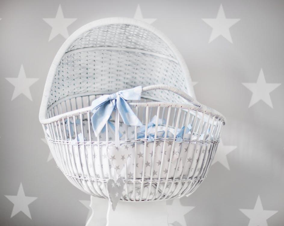 Free Baby's White and Gray Star Printed Bassinet Stock Photo